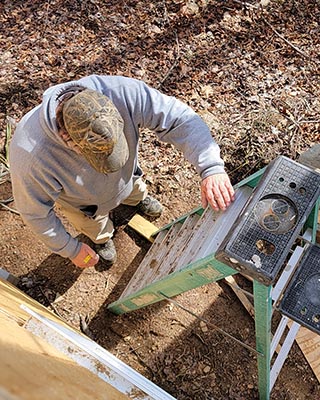Climbing ladder while building